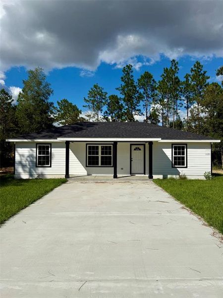 Front exterior of a new home in , Williston, FL, highlighting curb appeal (Image 1).