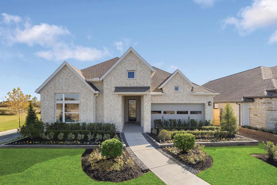 Representative exterior photo of a completed home built from the The Begonia by David Weekley Homes in Grand Central Park 55' Homesites, Conroe, TX (Image 2).