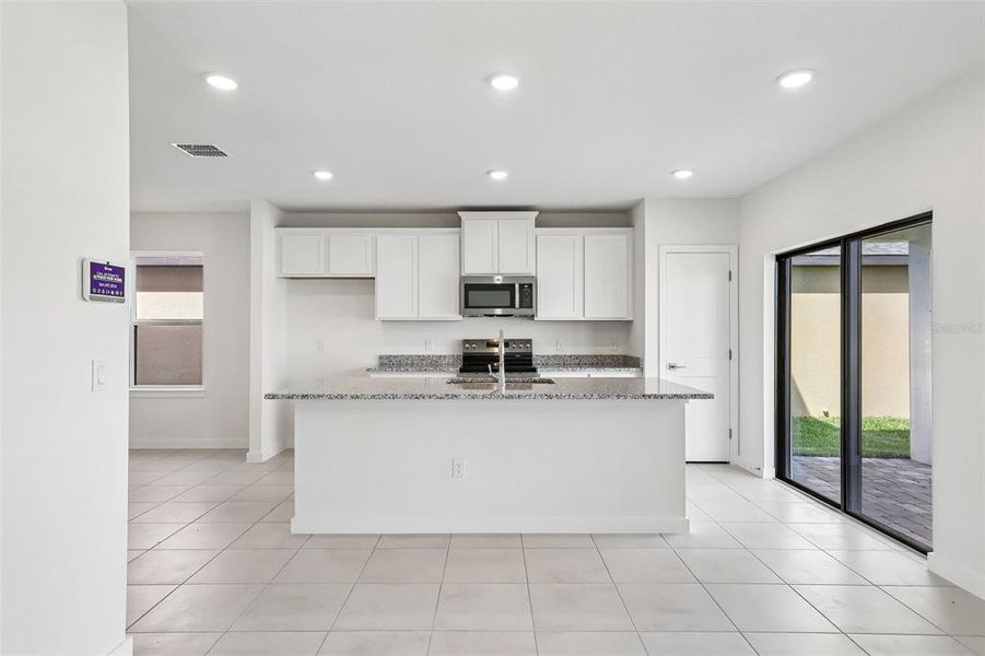 Furnished interior view inside a new home in Grasslands West, Lakeland (Image 7).