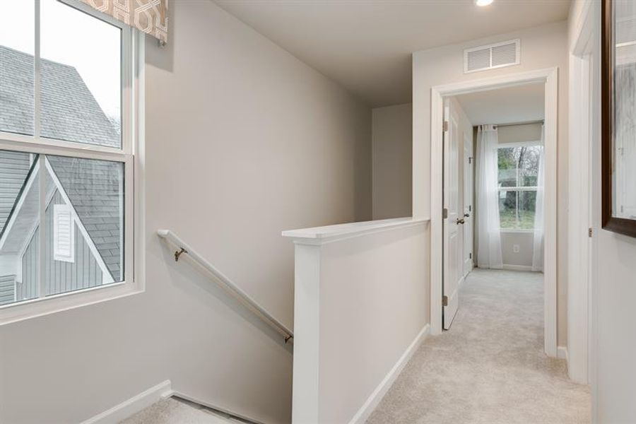 Representative unfurnished interior of a home built from the Tate by Ryan Homes in Middle Creek Village Coastal Cottages & Villas, Bolivia (Image 19).