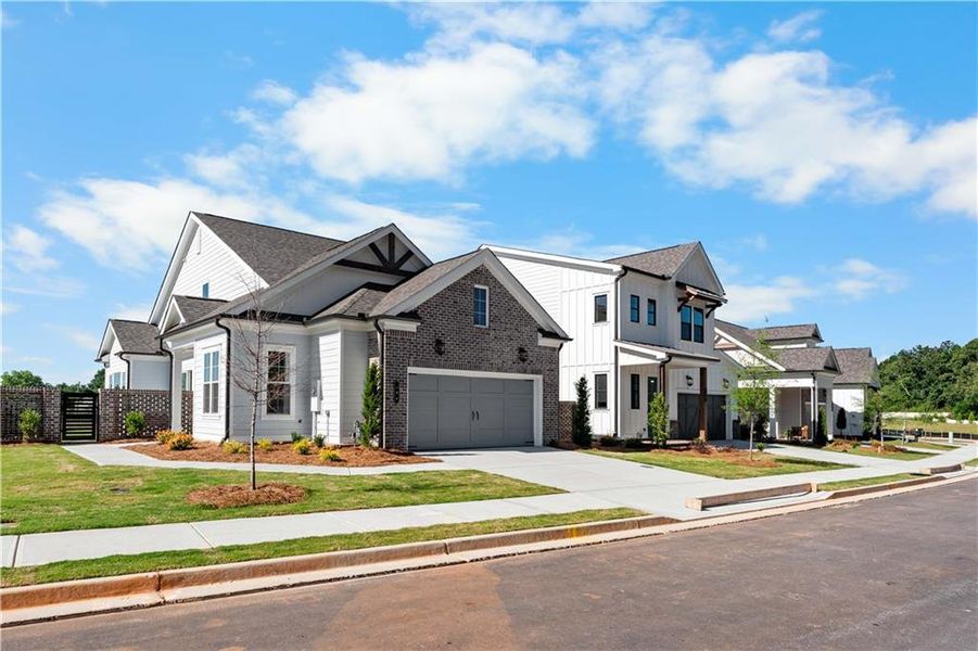 Front exterior of a new home in Aberdeen, Hoschton, GA, highlighting curb appeal (Image 25). Front exterior of a new home in Aberdeen, Hoschton, GA, highlighting curb appeal (Image 25).
