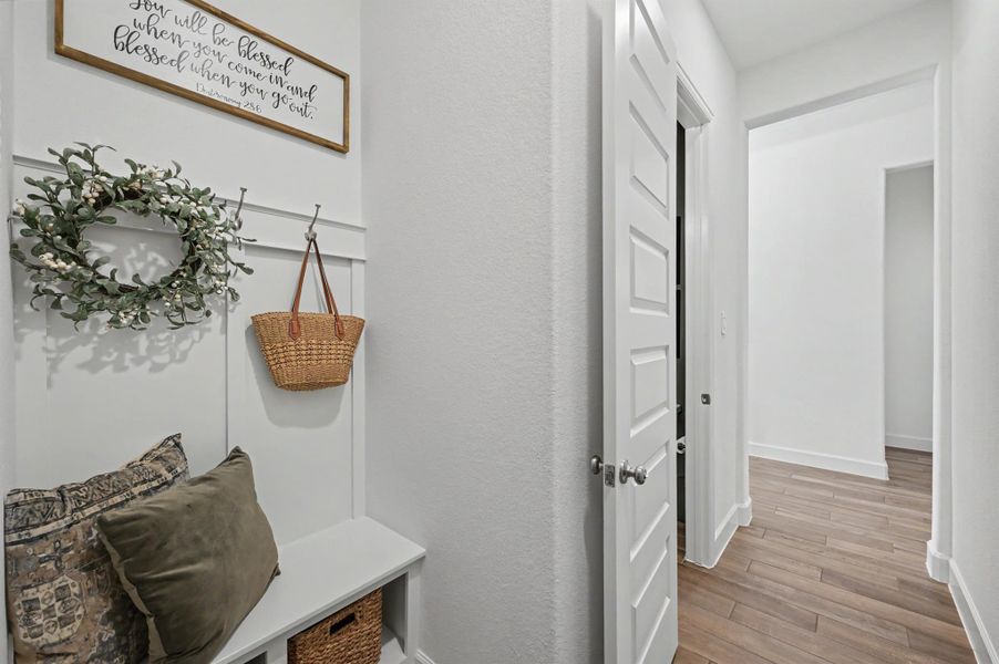 Past the half bath is this drop zone with pegs, a bench, and storage. A convenient spot to help stay organized! Past the half bath is this drop zone with pegs, a bench, and storage. A convenient spot to help stay organized!