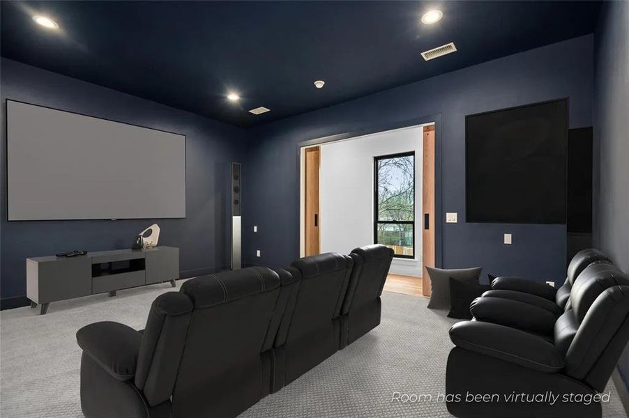 Media room featuring a large projection screen, recessed lighting, and a dark-painted ceiling Media room featuring a large projection screen, recessed lighting, and a dark-painted ceiling