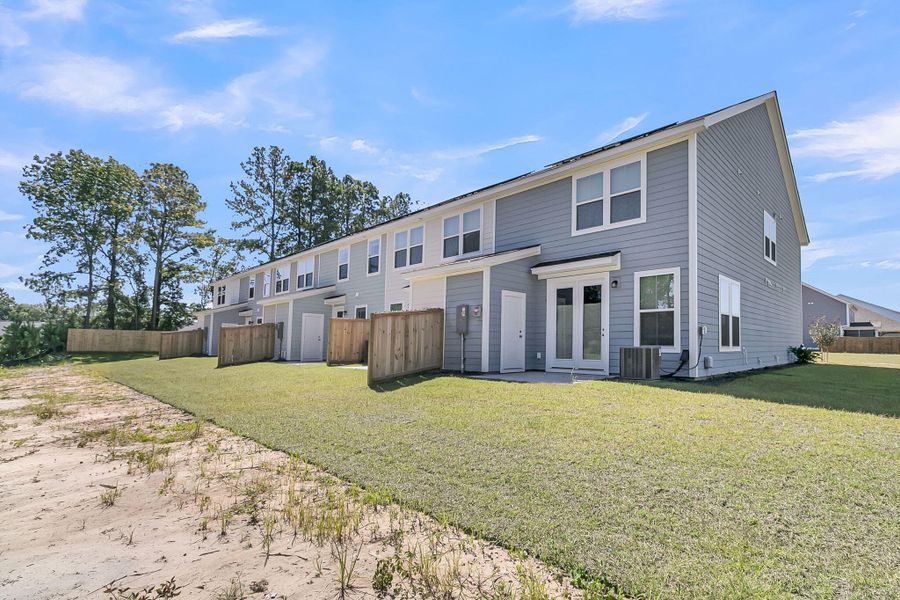 Front exterior of a new home in Abbey Walk, Moncks Corner, SC, highlighting curb appeal (Image 24).