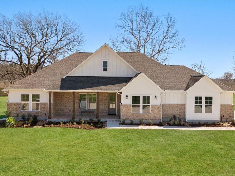 Front exterior of a new home in , Smithville, TX, highlighting curb appeal (Image 2). Front exterior of a new home in , Smithville, TX, highlighting curb appeal (Image 2).