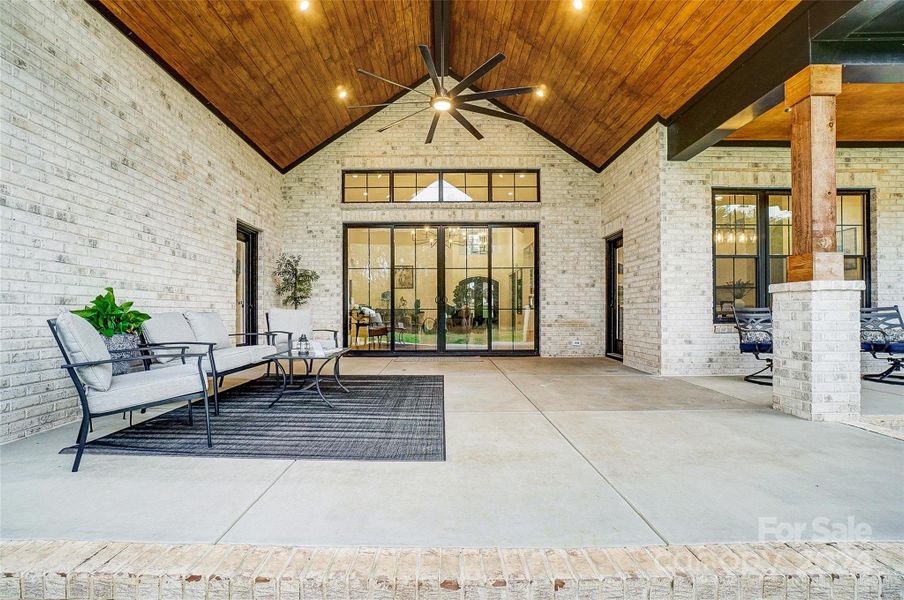 Large covered back porch with vaulted ceiling