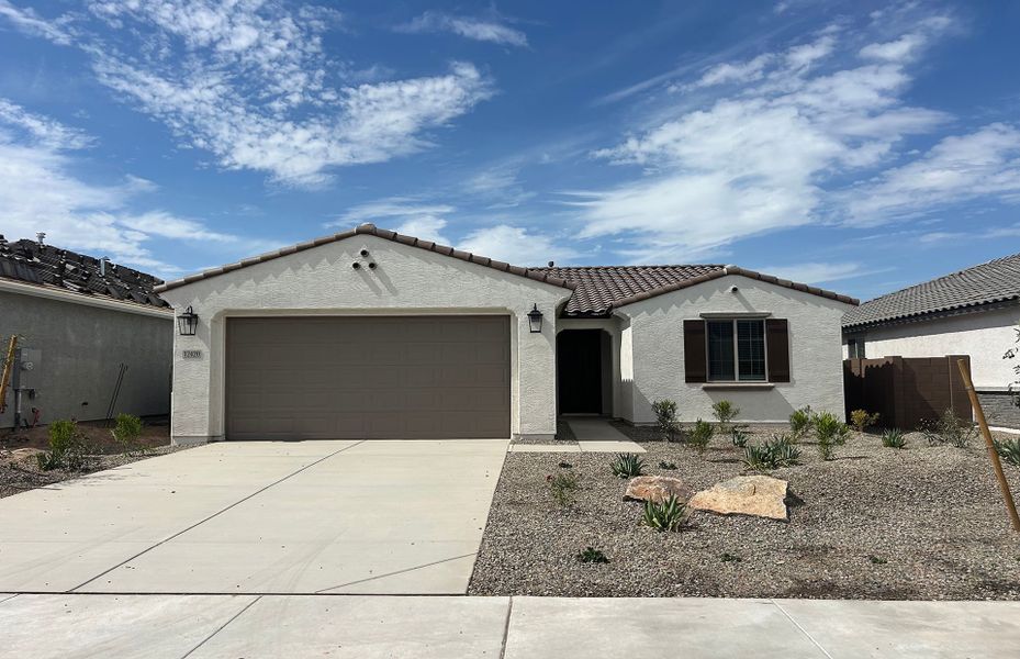 Front exterior of a new home in Alamar, Avondale, AZ, highlighting curb appeal (Image 1). Front exterior of a new home in Alamar, Avondale, AZ, highlighting curb appeal (Image 1).