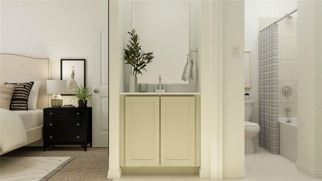 Bedroom featuring ensuite bathroom and sink