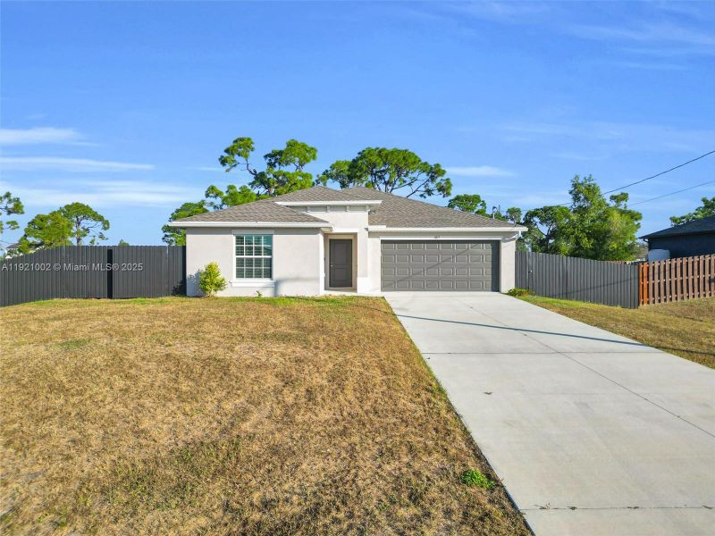 Front exterior of a new home in , Cape Coral, FL, highlighting curb appeal (Image 19). Front exterior of a new home in , Cape Coral, FL, highlighting curb appeal (Image 19).