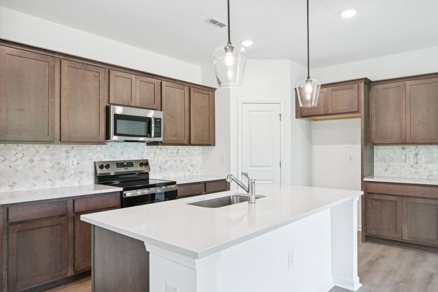 Representative furnished interior of a home built from the Meadow by Ashton Woods in Middleton Farms, Middlesex (Image 3).