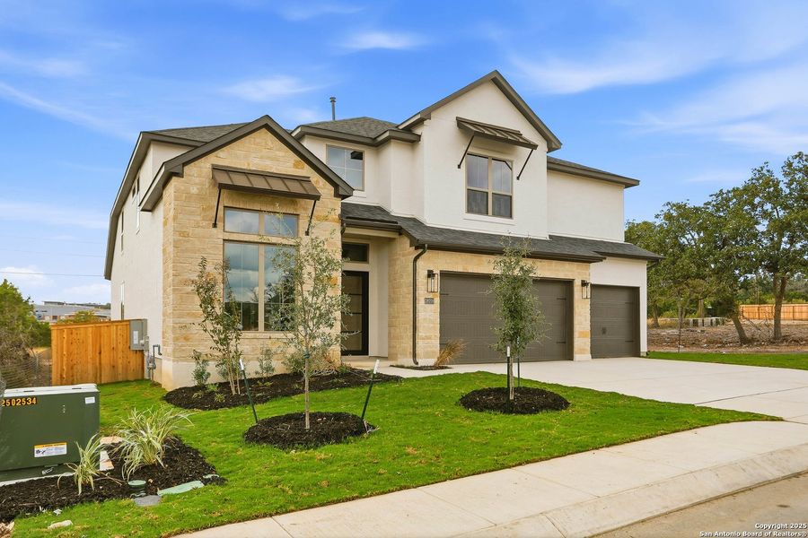 Front exterior of a new home in Kinder Ranch 70's, San Antonio, TX, highlighting curb appeal (Image 2).