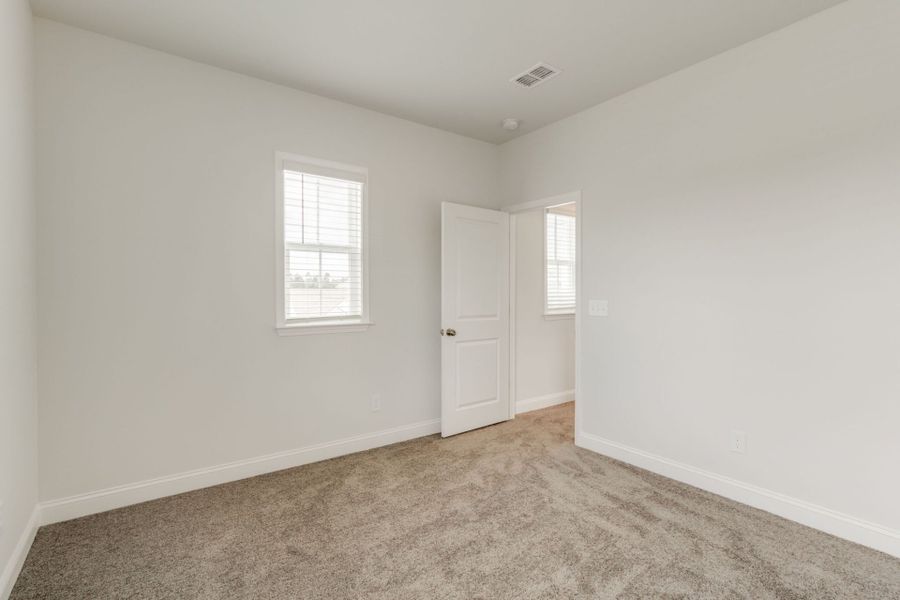 Spacious, unfurnished interior of a new home in Pecan Orchard, Elgin (Image 22).