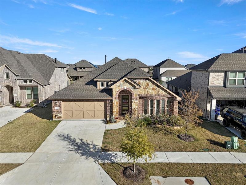 Front exterior of a new home in Union Park Classic 60, Little Elm, TX, highlighting curb appeal (Image 21).