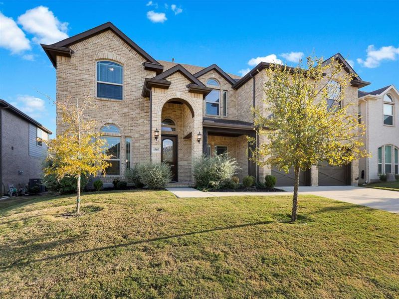Front exterior of a new home in , Mansfield, TX, highlighting curb appeal (Image 2).