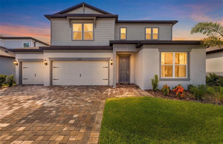 Front exterior of a new home in Waterset, Apollo Beach, FL, highlighting curb appeal (Image 1). Front exterior of a new home in Waterset, Apollo Beach, FL, highlighting curb appeal (Image 1).