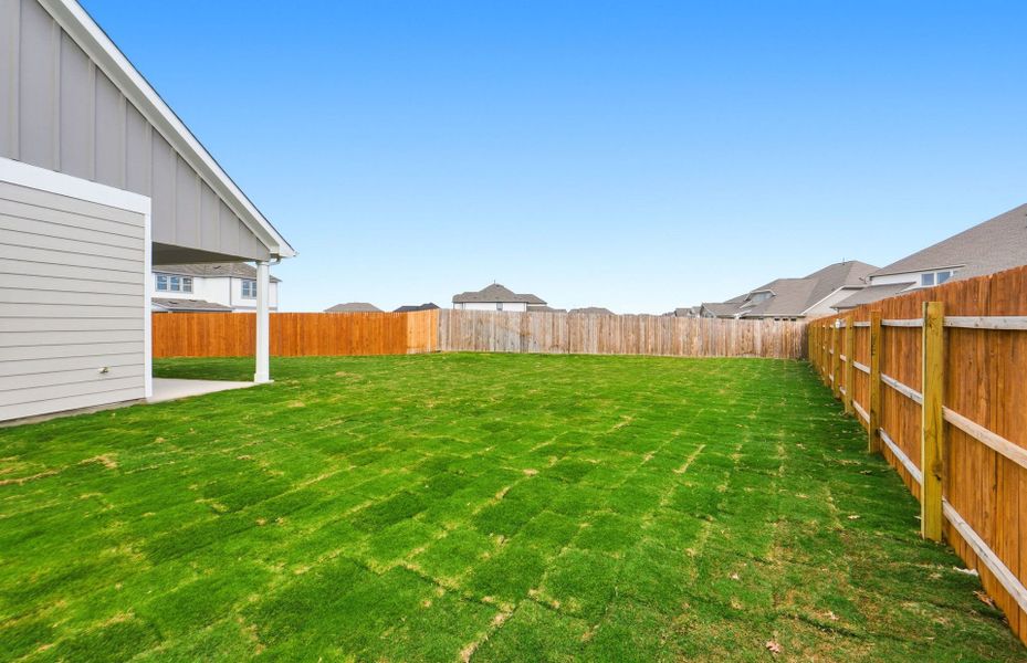 Exterior details and patio area of a home in Santa Rita Ranch, Liberty Hill (Image 25).