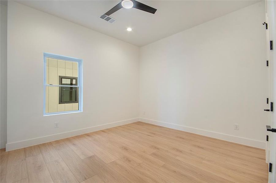 Empty room featuring light wood-type flooring, recessed lighting, and ceiling fan Empty room featuring light wood-type flooring, recessed lighting, and ceiling fan