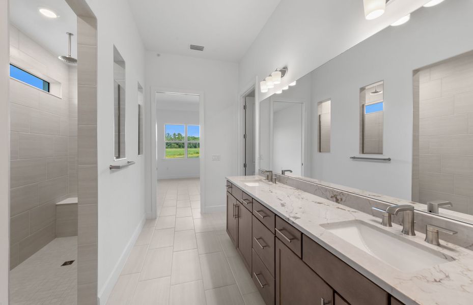 Owner's bathroom with dual-sink vanity and spacious shower
