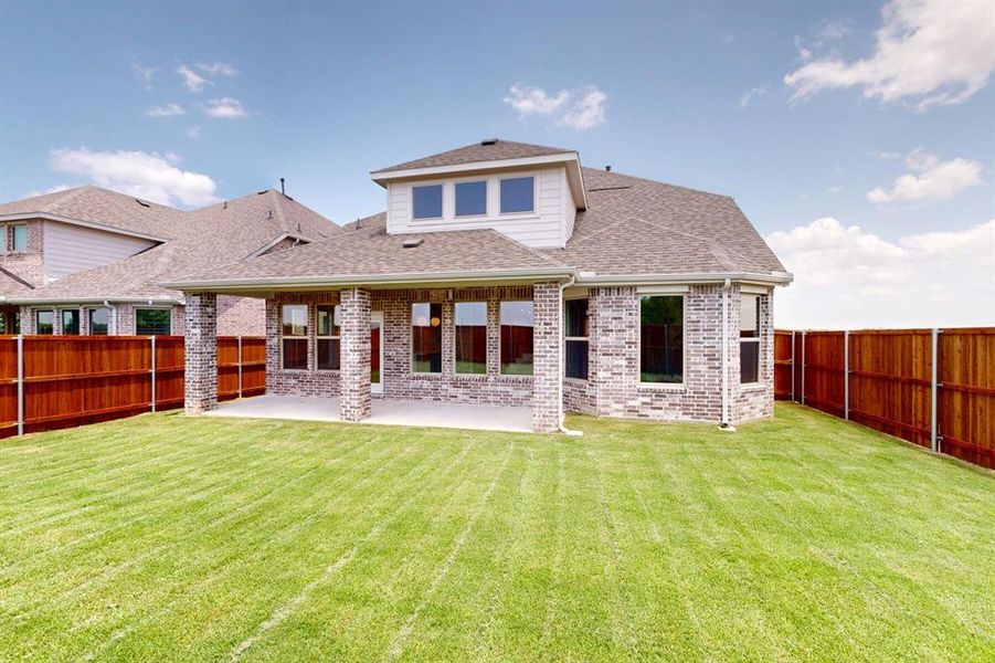 Front exterior of a new home in Lilybrooke at Legacy Hills, Celina, TX, highlighting curb appeal (Image 2).