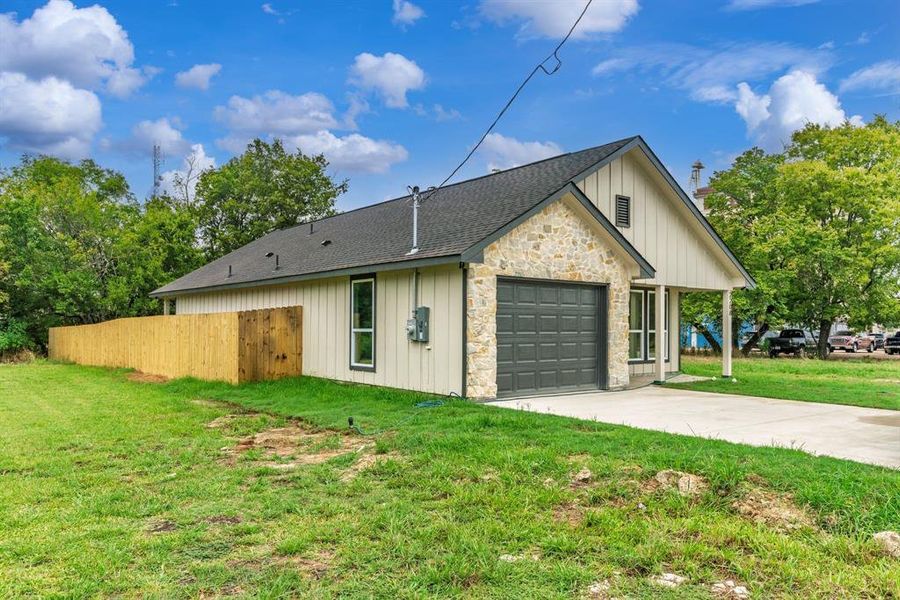 Front exterior of a new home in , Greenville, TX, highlighting curb appeal (Image 23). Front exterior of a new home in , Greenville, TX, highlighting curb appeal (Image 23).