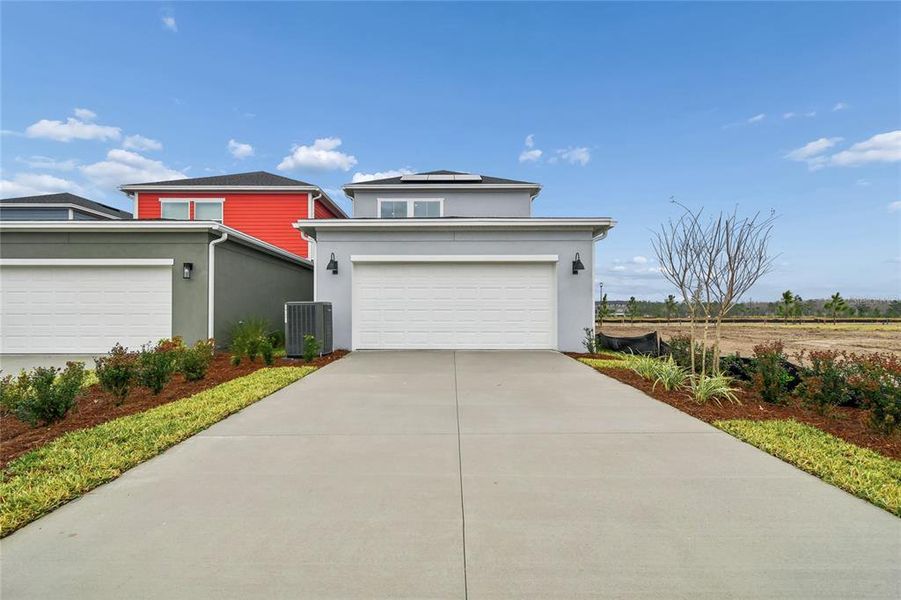 Front exterior of a new home in Laureate Park at Lake Nona - Garden Series, Orlando, FL, highlighting curb appeal (Image 20).