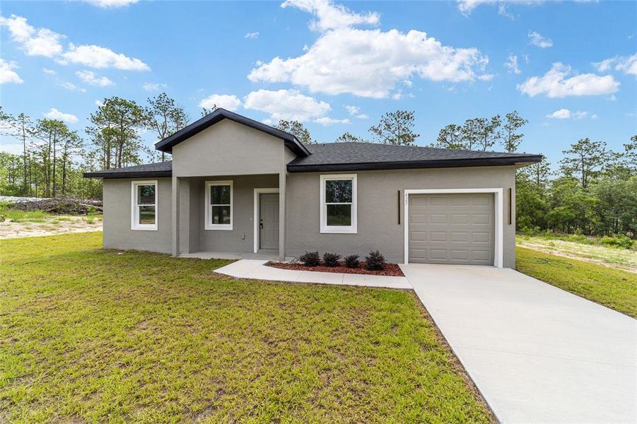 Front exterior of a new home in , Dunnellon, FL, highlighting curb appeal (Image 18). Front exterior of a new home in , Dunnellon, FL, highlighting curb appeal (Image 18).