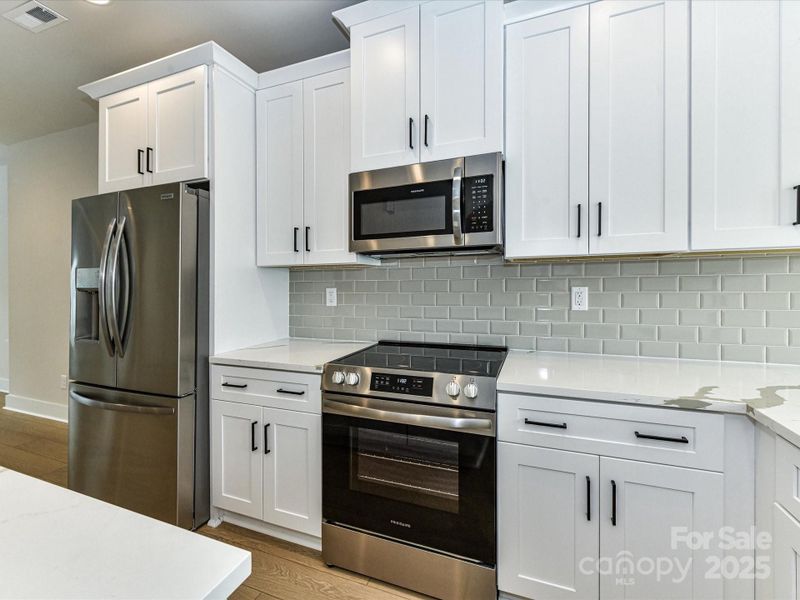 Furnished interior view inside a new home in North End Terraces, Charlotte (Image 8).