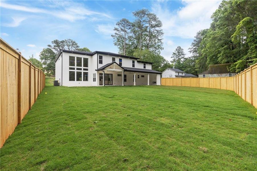 Front exterior of a new home in , Lilburn, GA, highlighting curb appeal (Image 30).