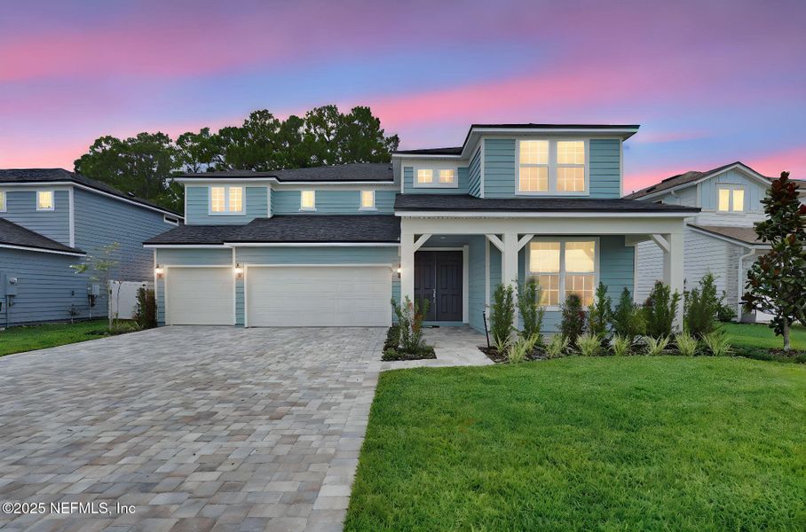 Front exterior of a new home in The Preserve at Bannon Lakes, St. Augustine, FL, highlighting curb appeal (Image 1). Front exterior of a new home in The Preserve at Bannon Lakes, St. Augustine, FL, highlighting curb appeal (Image 1).