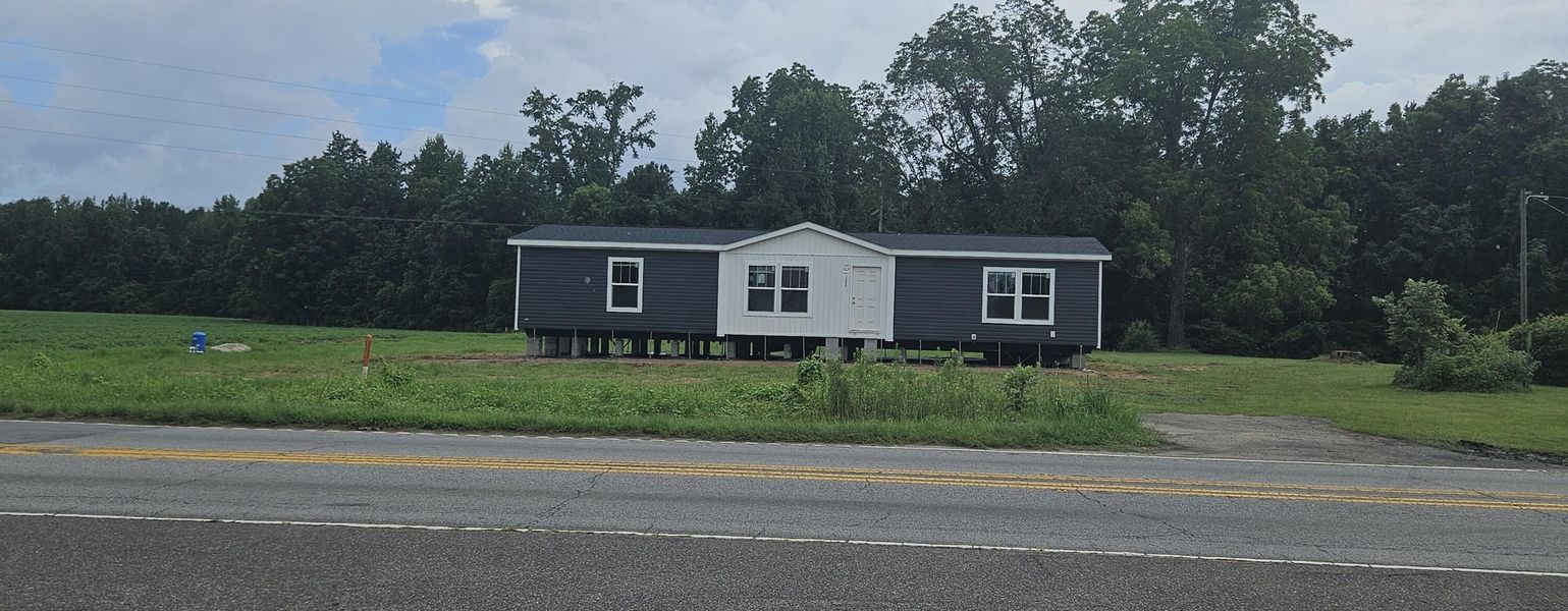 Front exterior of a new home in , Harleyville, SC, highlighting curb appeal (Image 1).