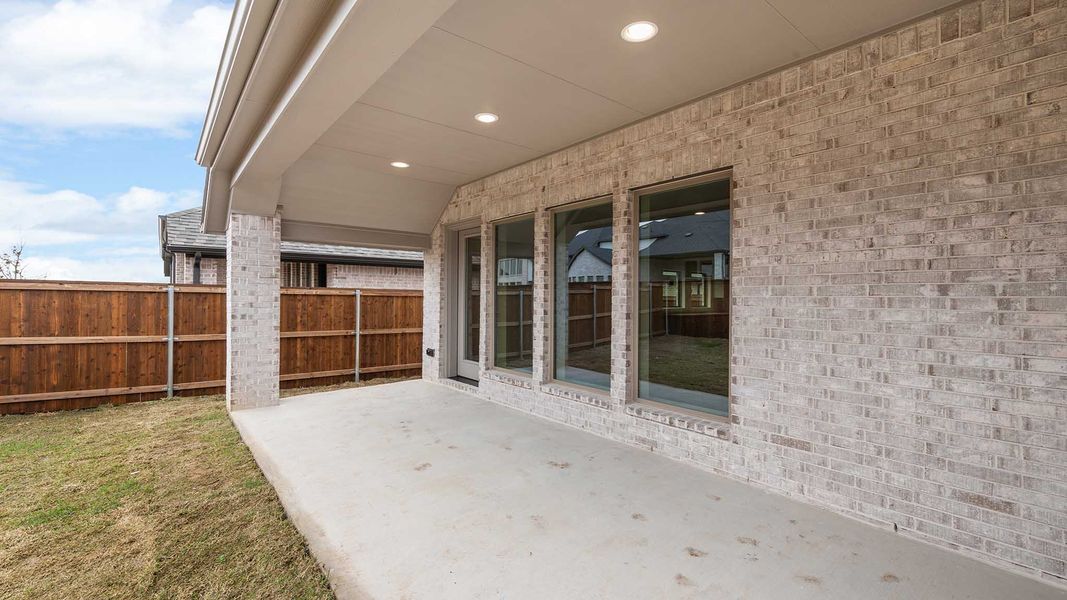Exterior details and patio area of a home in Cambridge Crossing, Celina (Image 34).