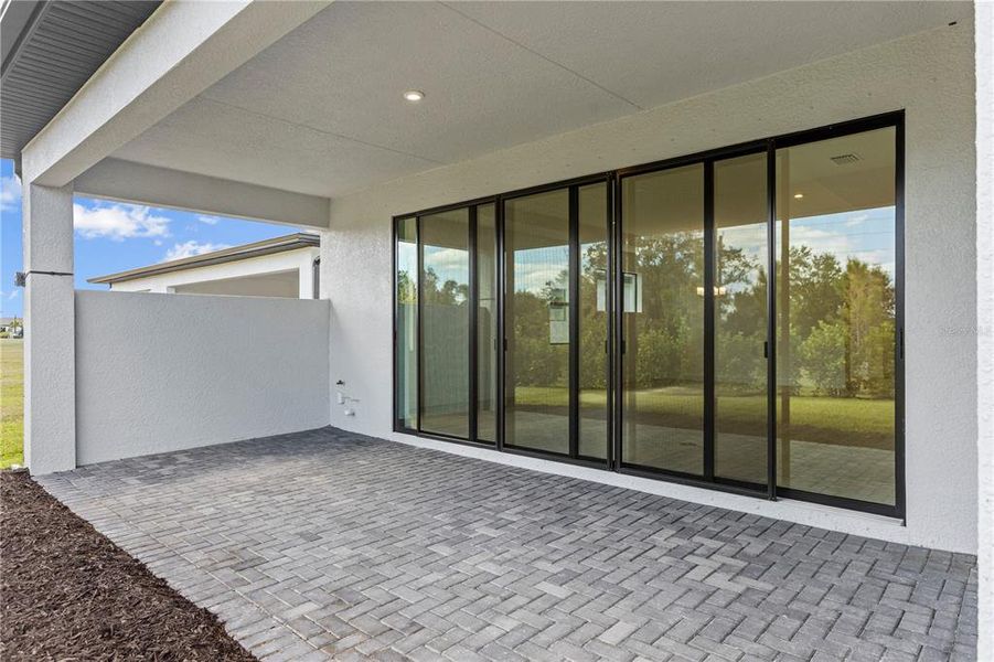 Exterior details and patio area of a home in Woodland Preserve, Parrish (Image 24).