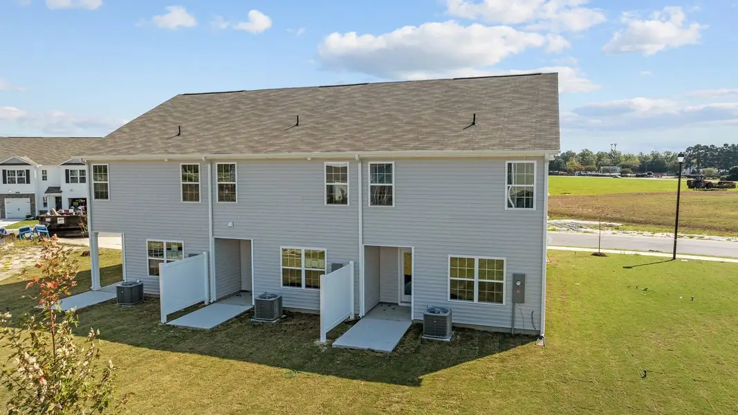 Exterior details and patio area of a home in The Townes at Ridgewood Farms, Winterville (Image 23).