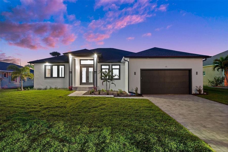 Front exterior of a new home in , Rotonda West, FL, highlighting curb appeal (Image 2).
