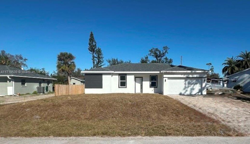 Front exterior of a new home in , Port Charlotte, FL, highlighting curb appeal (Image 2).