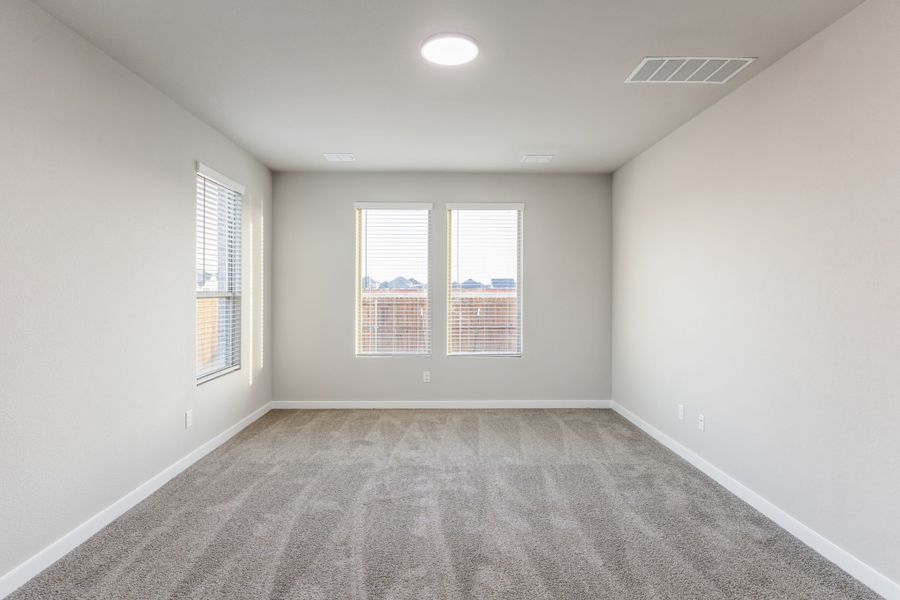 Primary Suite in the Wimbledon home plan by Trophy Signature Homes – REPRESENTATIVE PHOTO