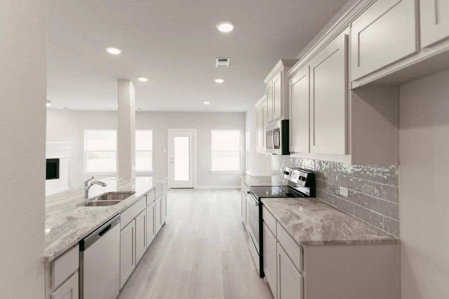 Representative furnished interior of a home built from the Hudson by Stonehollow Homes in Heritage Grove, Blue Ridge (Image 5).