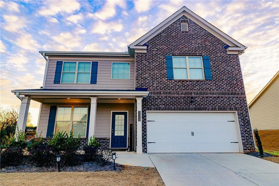 Front exterior of a new home in Hellen Valley, Braselton, GA, highlighting curb appeal (Image 23).
