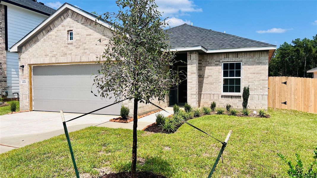 Front exterior of a new home in Cielo, Conroe, TX, highlighting curb appeal (Image 1). Front exterior of a new home in Cielo, Conroe, TX, highlighting curb appeal (Image 1).