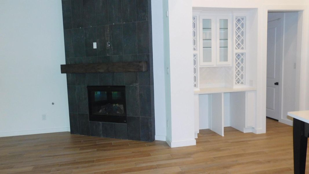 Built-In Wine Storage and View of Fireplace