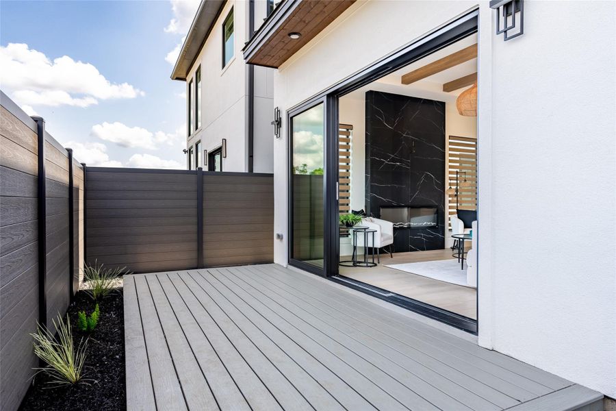 A 12-ft sliding glass door invites you into a private backyard retreat designed for effortless outdoor living. Optional 12x8 composite deck creates the perfect spot to unwind and enjoy peaceful evenings under the open sky