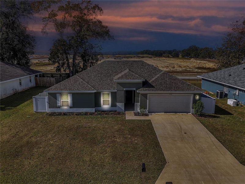 Front exterior of a new home in Diamond Ridge, Belleview, FL, highlighting curb appeal (Image 2).