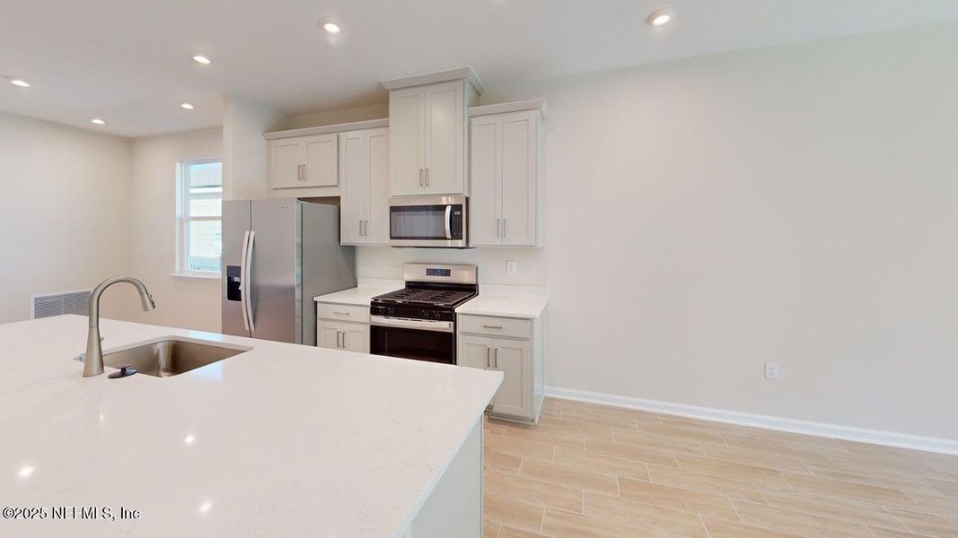 Furnished interior view inside a new home in RiverTown - Forest, St. Johns (Image 5).