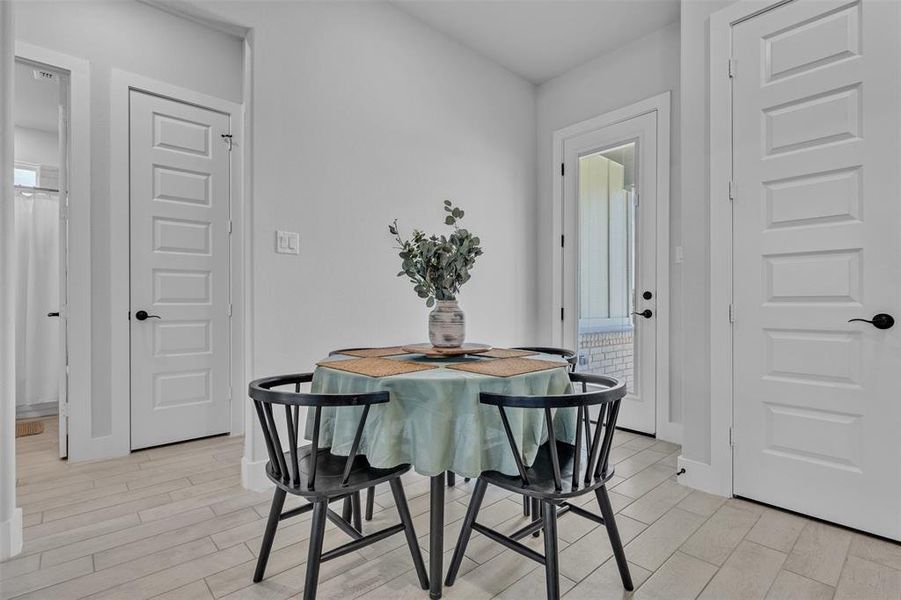 Neutral wall colors complement the light wood-finish flooring