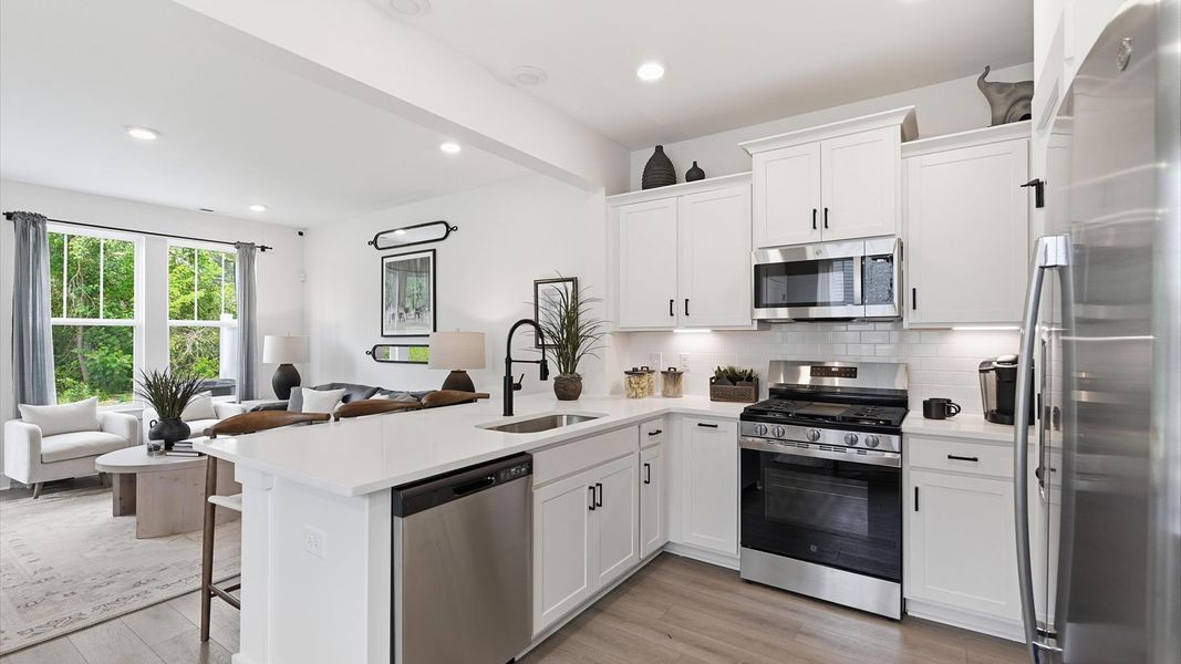 Refined kitchen layout of The Churchill Design offering both entertaining space and everyday functionality