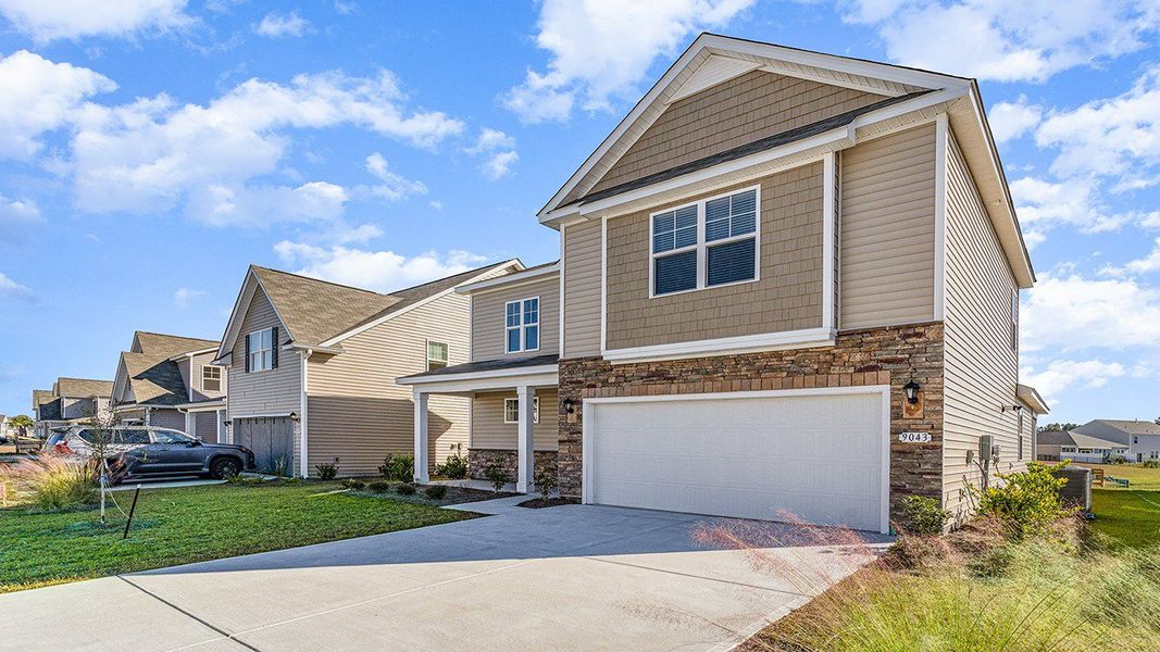 Representative exterior photo of a completed home built from the BELFORT by D.R. Horton in Heron Pointe, Myrtle Beach, SC (Image 17). Representative exterior photo of a completed home built from the BELFORT by D.R. Horton in Heron Pointe, Myrtle Beach, SC (Image 17).