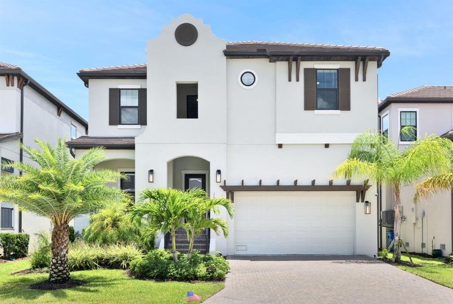 Front exterior of a new home in SouthShore Yacht Club, Ruskin, FL, highlighting curb appeal (Image 22). Front exterior of a new home in SouthShore Yacht Club, Ruskin, FL, highlighting curb appeal (Image 22).