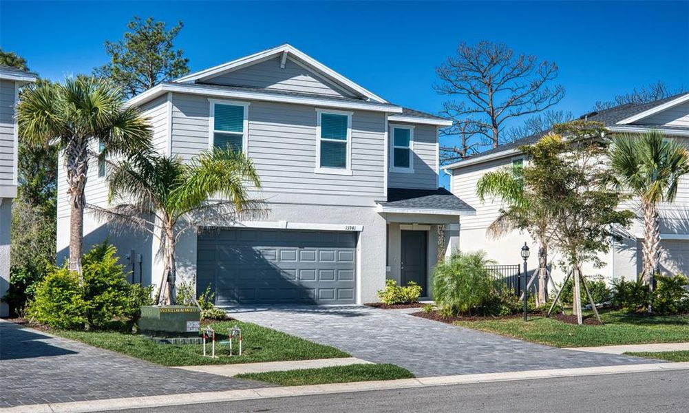 Front exterior of a new home in , Bradenton, FL, highlighting curb appeal (Image 2).