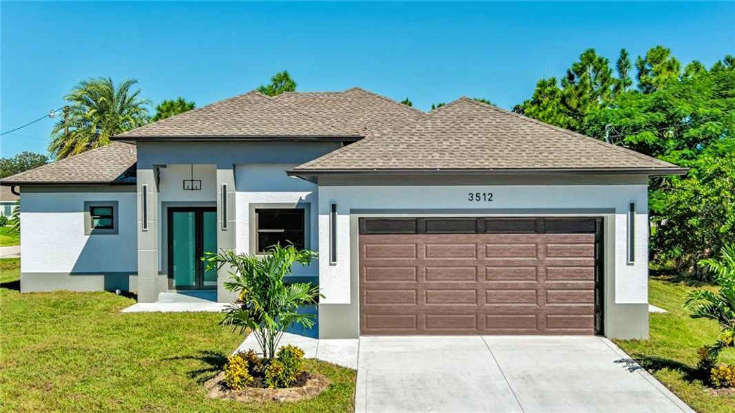 Front exterior of a new home in , Lehigh Acres, FL, highlighting curb appeal (Image 22).