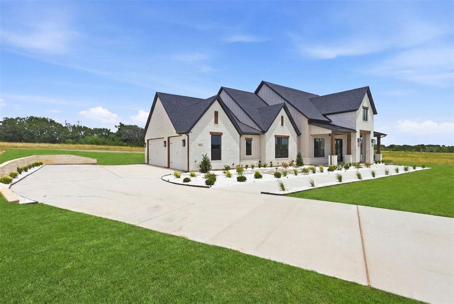 Front exterior of a new home in , Granbury, TX, highlighting curb appeal (Image 2). Front exterior of a new home in , Granbury, TX, highlighting curb appeal (Image 2).